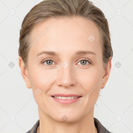 Joyful white young-adult female with short  brown hair and grey eyes