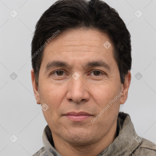 Joyful white adult male with short  brown hair and brown eyes