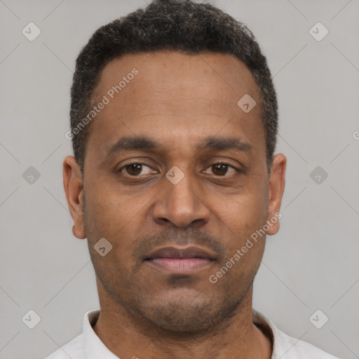 Neutral latino young-adult male with short  brown hair and brown eyes