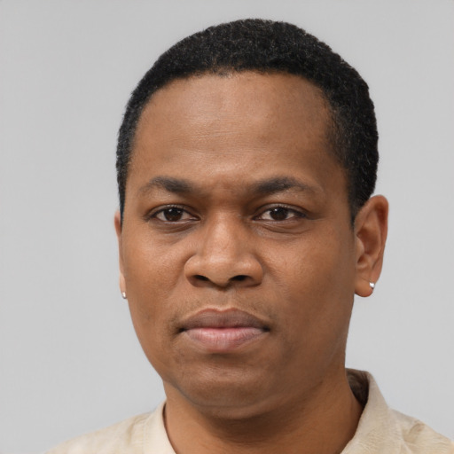 Neutral latino adult male with short  black hair and brown eyes