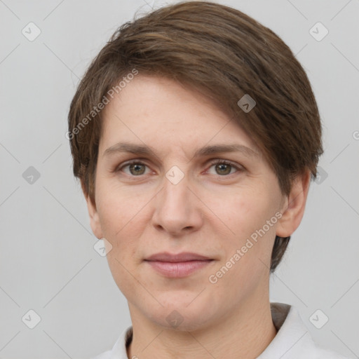 Joyful white adult female with short  brown hair and grey eyes