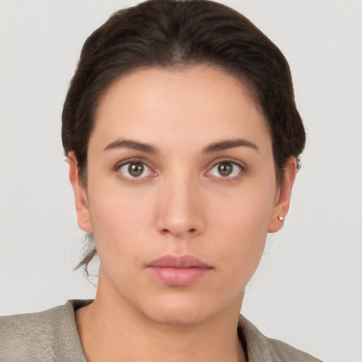 Neutral white young-adult female with short  brown hair and brown eyes