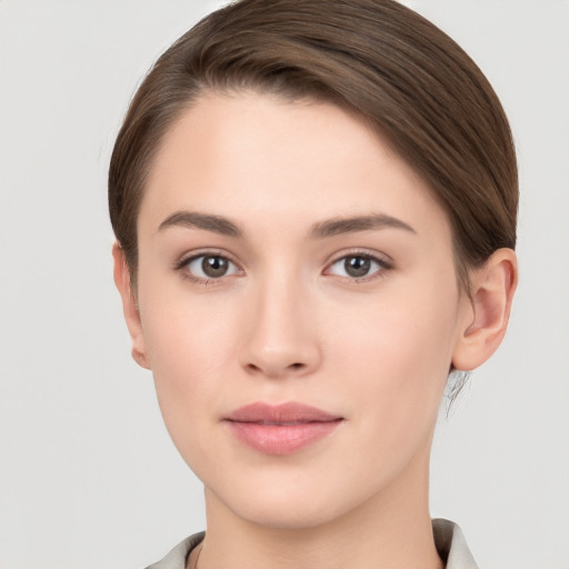 Neutral white young-adult female with short  brown hair and brown eyes