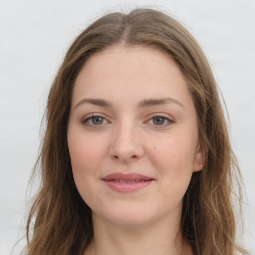 Joyful white young-adult female with long  brown hair and grey eyes