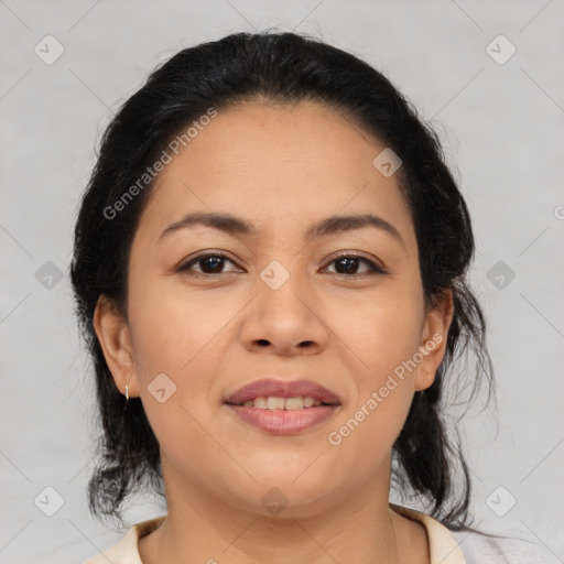 Joyful latino young-adult female with medium  brown hair and brown eyes