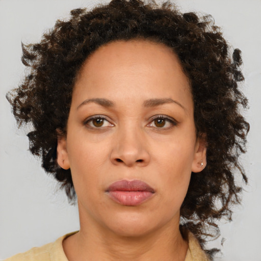 Neutral black adult female with medium  brown hair and brown eyes