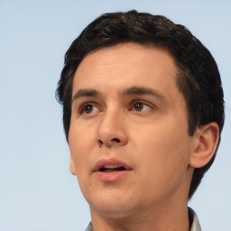 Neutral white adult male with short  black hair and brown eyes