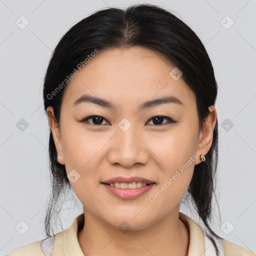 Joyful asian young-adult female with medium  brown hair and brown eyes