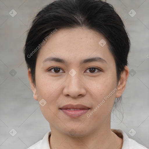 Joyful asian young-adult female with short  brown hair and brown eyes