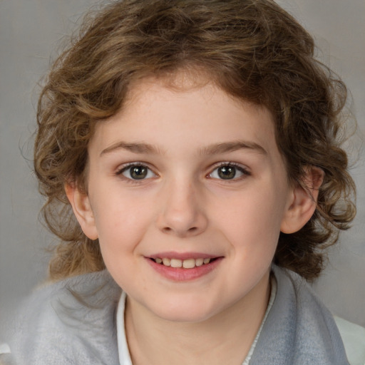 Joyful white child female with medium  brown hair and brown eyes