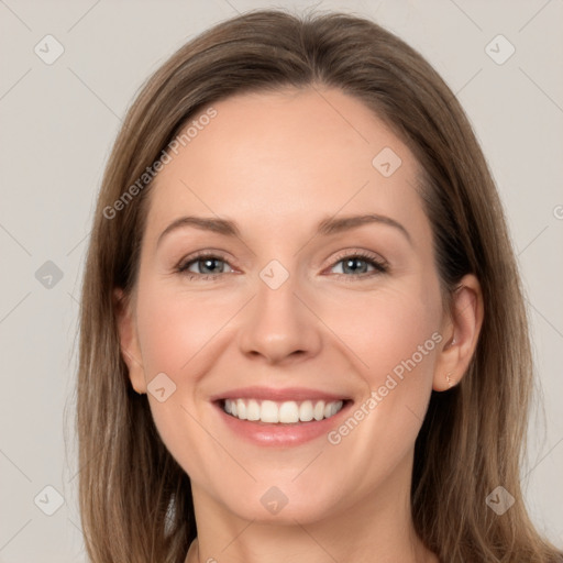 Joyful white young-adult female with long  brown hair and grey eyes