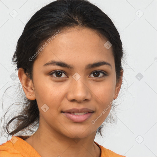 Joyful latino young-adult female with medium  brown hair and brown eyes