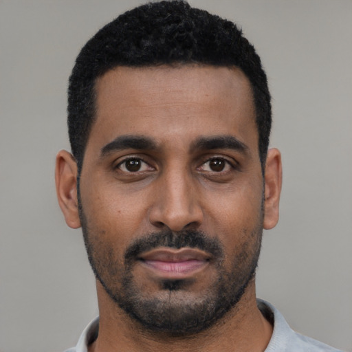 Neutral black young-adult male with short  black hair and brown eyes