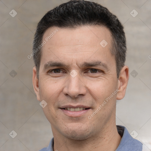 Joyful white adult male with short  black hair and brown eyes