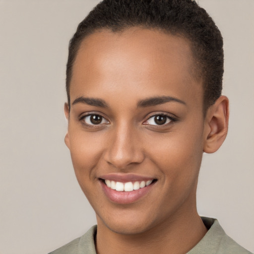 Joyful latino young-adult female with short  brown hair and brown eyes