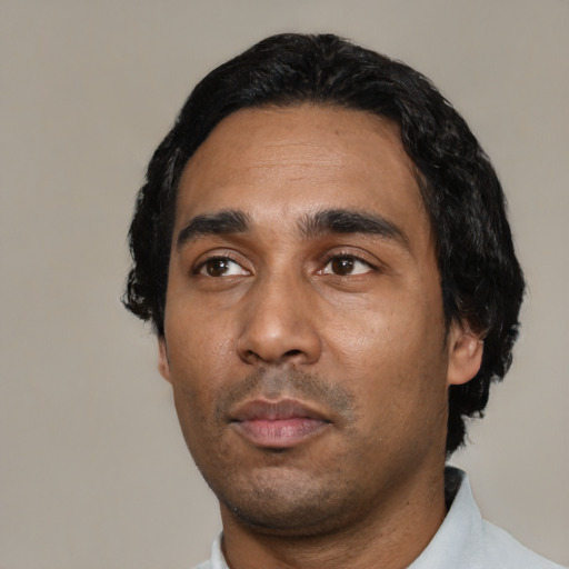 Neutral latino adult male with short  black hair and brown eyes