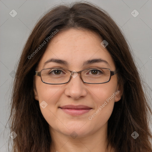 Joyful white adult female with long  brown hair and brown eyes