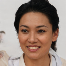 Joyful asian young-adult female with short  brown hair and brown eyes