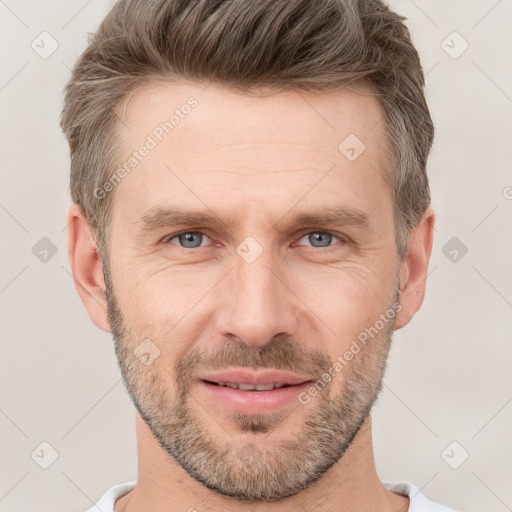 Joyful white adult male with short  brown hair and brown eyes