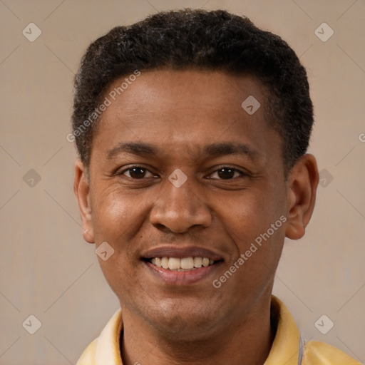 Joyful latino young-adult male with short  brown hair and brown eyes