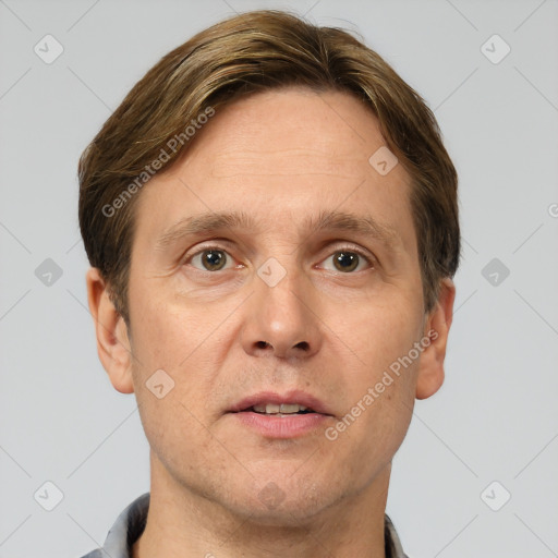 Joyful white adult male with short  brown hair and grey eyes