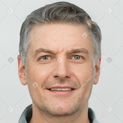 Joyful white adult male with short  brown hair and grey eyes