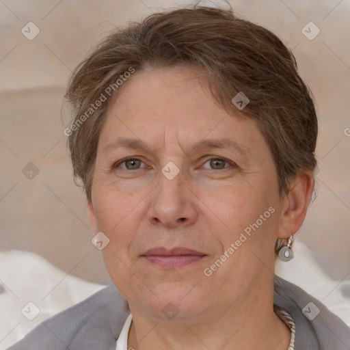 Joyful white adult female with short  brown hair and grey eyes