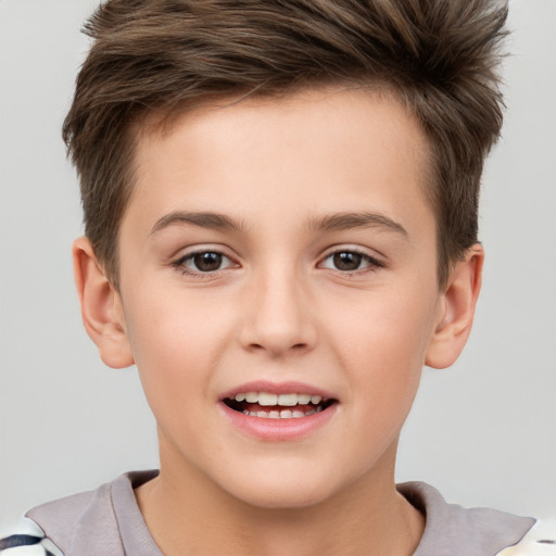 Joyful white child male with short  brown hair and brown eyes