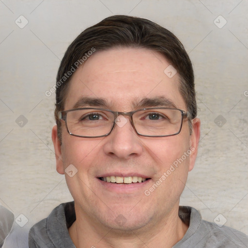 Joyful white adult male with short  brown hair and grey eyes