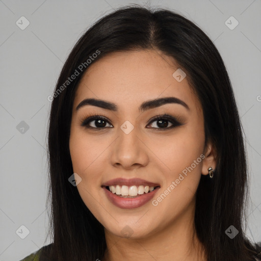 Joyful latino young-adult female with long  black hair and brown eyes