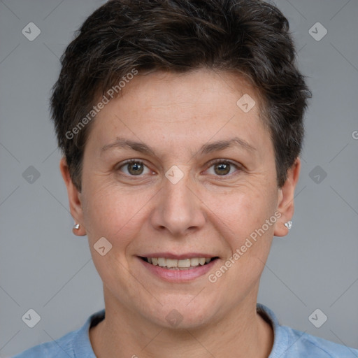 Joyful white adult female with short  brown hair and brown eyes