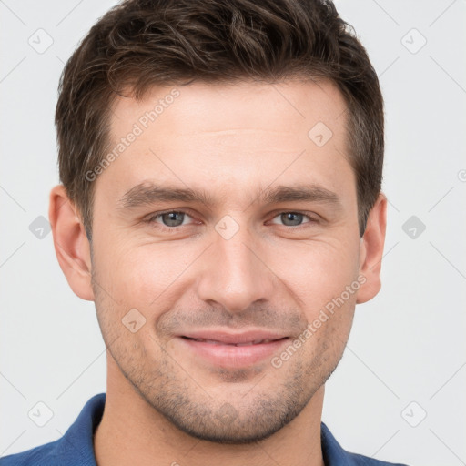 Joyful white young-adult male with short  brown hair and brown eyes