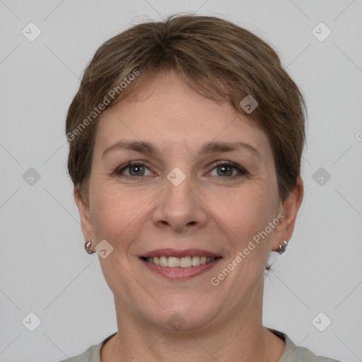 Joyful white young-adult female with short  brown hair and grey eyes