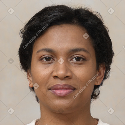 Joyful black young-adult female with short  brown hair and brown eyes