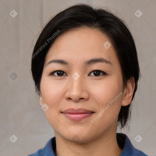 Joyful asian young-adult female with medium  black hair and brown eyes