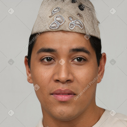 Joyful latino young-adult male with short  black hair and brown eyes