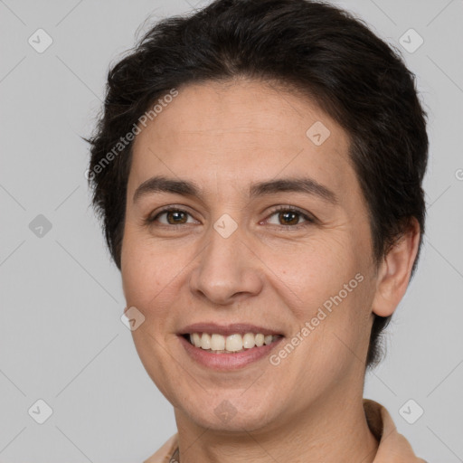 Joyful white adult female with short  brown hair and brown eyes