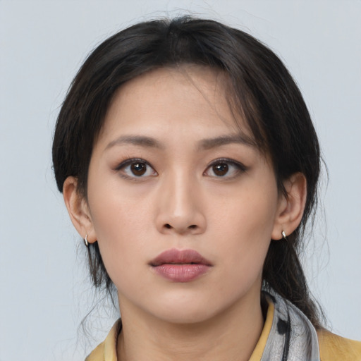 Neutral asian young-adult female with medium  brown hair and brown eyes