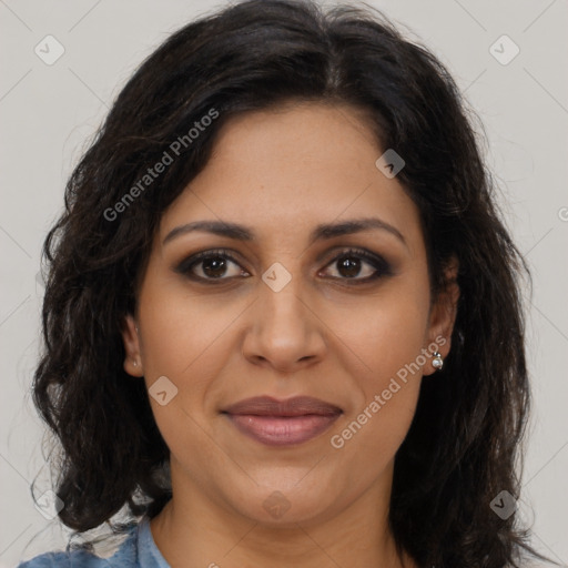 Joyful latino adult female with long  brown hair and brown eyes