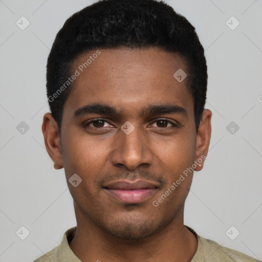 Joyful black young-adult male with short  black hair and brown eyes