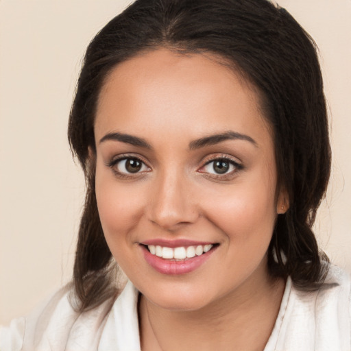 Joyful white young-adult female with medium  brown hair and brown eyes