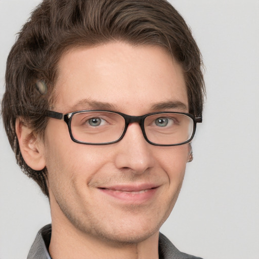 Joyful white adult male with short  brown hair and grey eyes