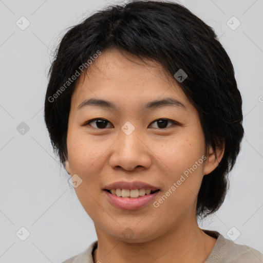 Joyful asian young-adult female with medium  brown hair and brown eyes