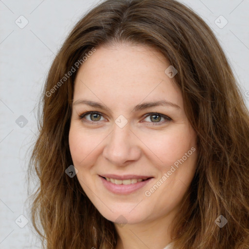 Joyful white young-adult female with long  brown hair and green eyes