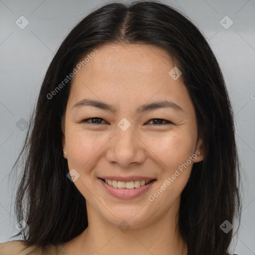 Joyful asian young-adult female with long  brown hair and brown eyes