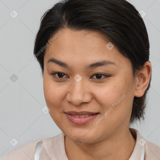 Joyful asian young-adult female with medium  brown hair and brown eyes