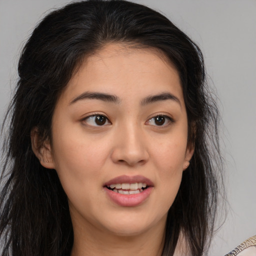 Joyful white young-adult female with long  brown hair and brown eyes