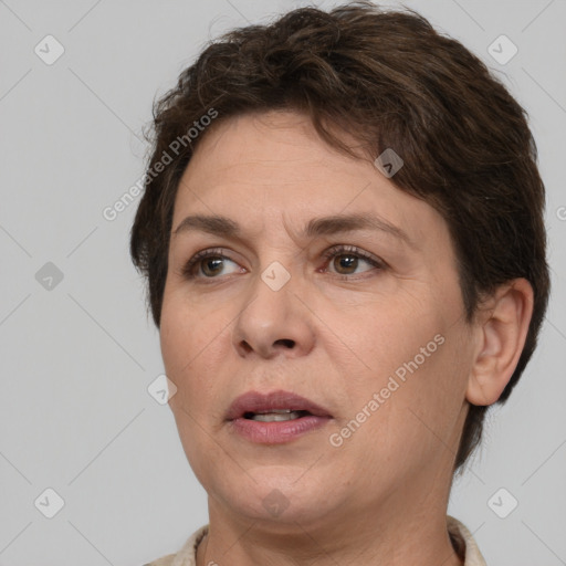 Joyful white adult female with short  brown hair and brown eyes