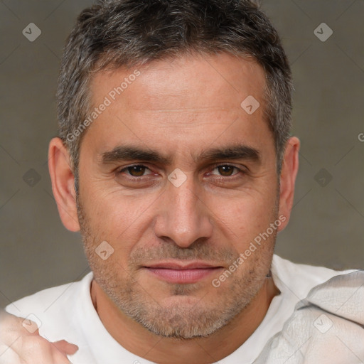 Joyful white adult male with short  brown hair and brown eyes