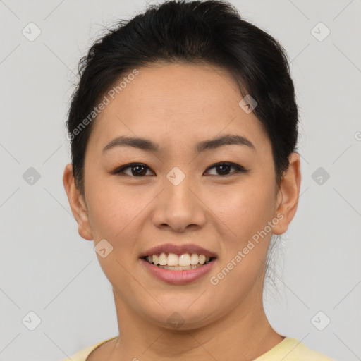 Joyful asian young-adult female with short  brown hair and brown eyes